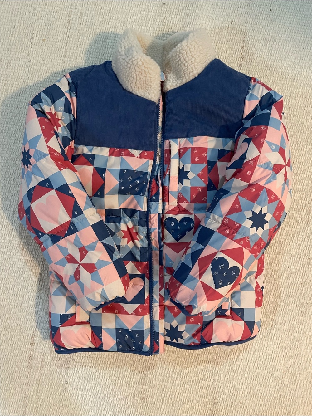 Mini Boden Geometric Patchwork Puffer Jacket in Navy, Pink & Red